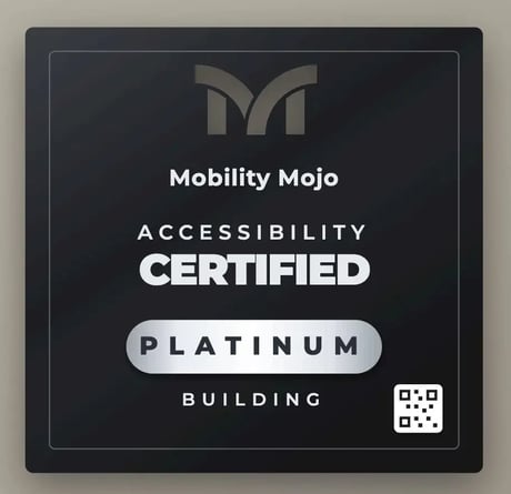 Mobility Mojo Accessibility Certified Platinum plaque with QR code, mounted on a wall