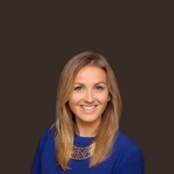 Headshot of Eimear Marrin; a blonde woman with mid length hair wearing a blue top