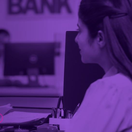 Customer being served at a bank branch counter